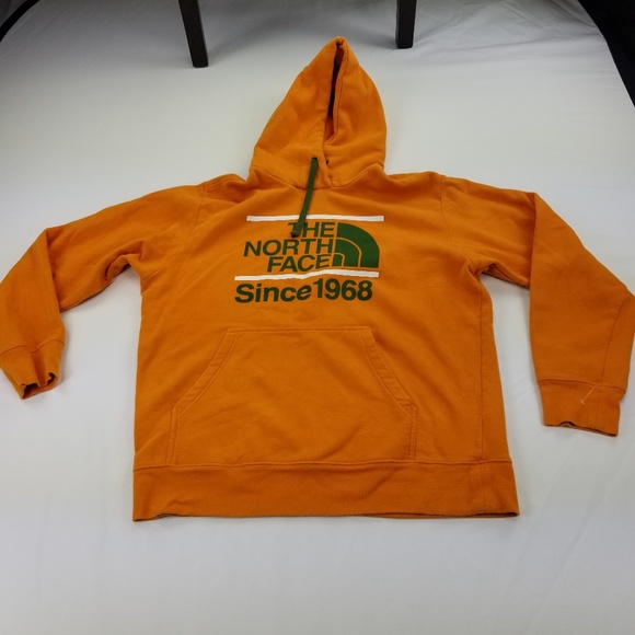 orange north face jumper